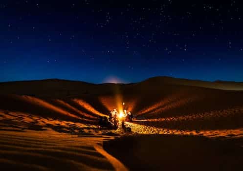 People Having Bonfire at Desert at Night