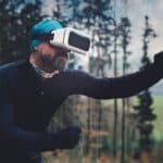 Person Wearing Black Henley Shirt and White Vr Goggles