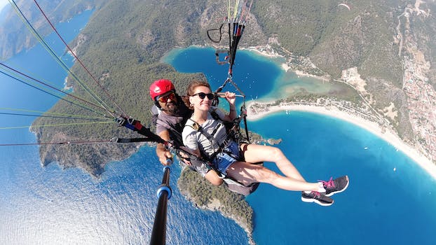 Selfie of Couple in Air on Parachute